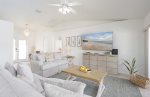 Bright And Airy Open Living Room Area with Love Seat and Couch